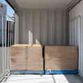 Two Australian pallets sitting side by side in an SCF container