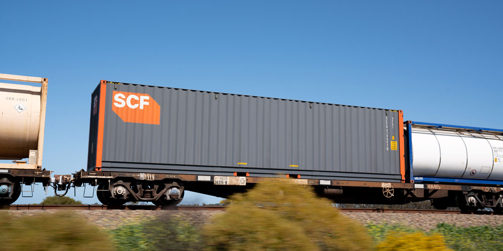 SCF Pallet Wide container being transported on rail