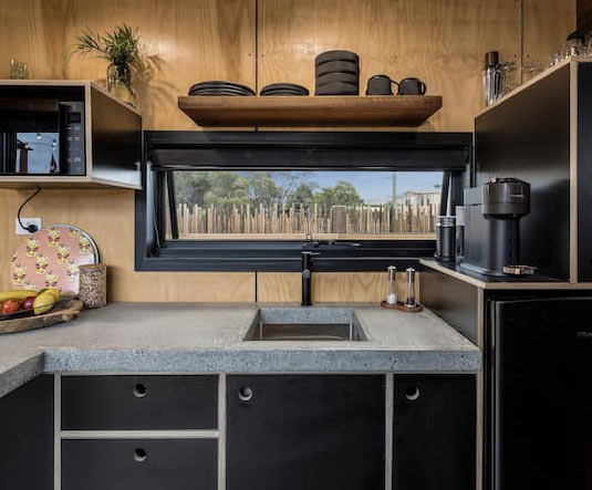 Have an outdoor space to showcase? Include a window in the kitchen during the design process. Source: AirBnB, Victoria, Australia.