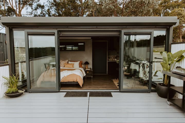 Create a indoor outdoor living space with large sliding doors. Source: AirBnB, Victoria, Australia.