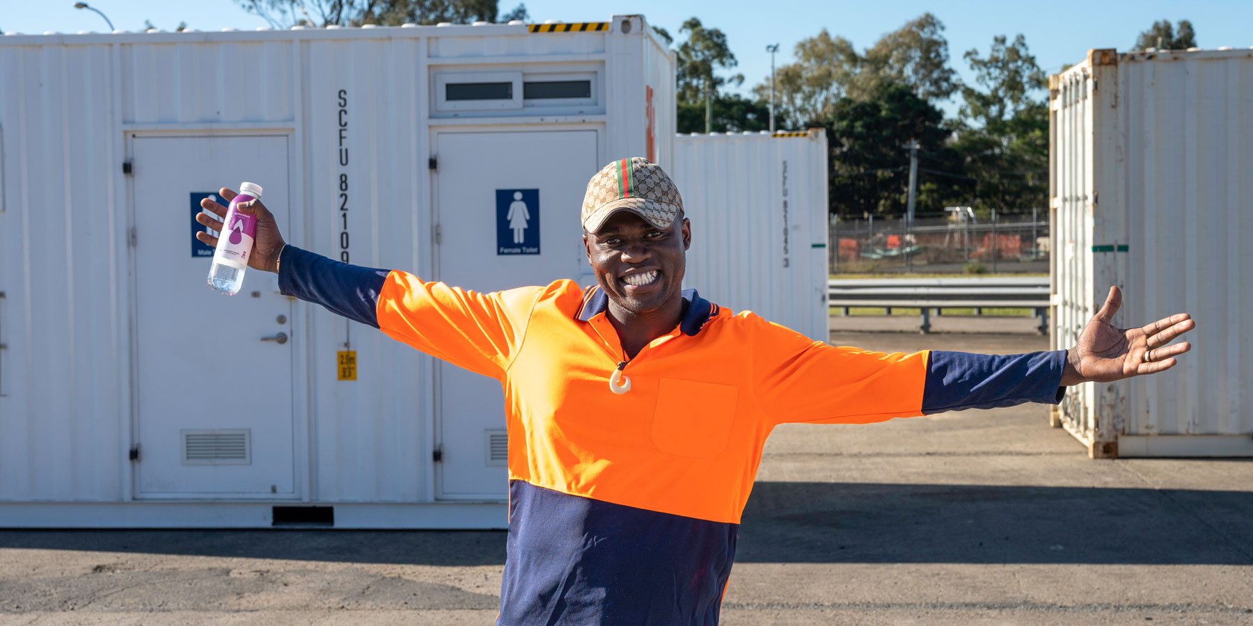 SCF worker happy in depot, on a sunny day