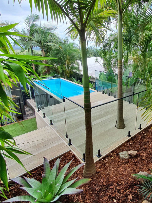 This container pool is hidden discreetly among a tropical garden. Source: Shipping Container Pools
