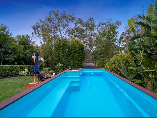 A neat container pool amongst landscaped gardens. Source: realestate.com.au