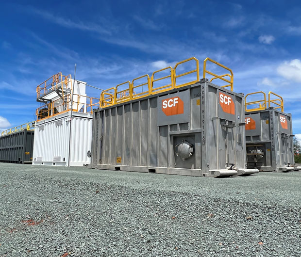 2 x 25ft Bulk Liquid Tanks, a 20ft Single Side Door Dangerous Goods Container and a 45ft Flowback Tank on site.